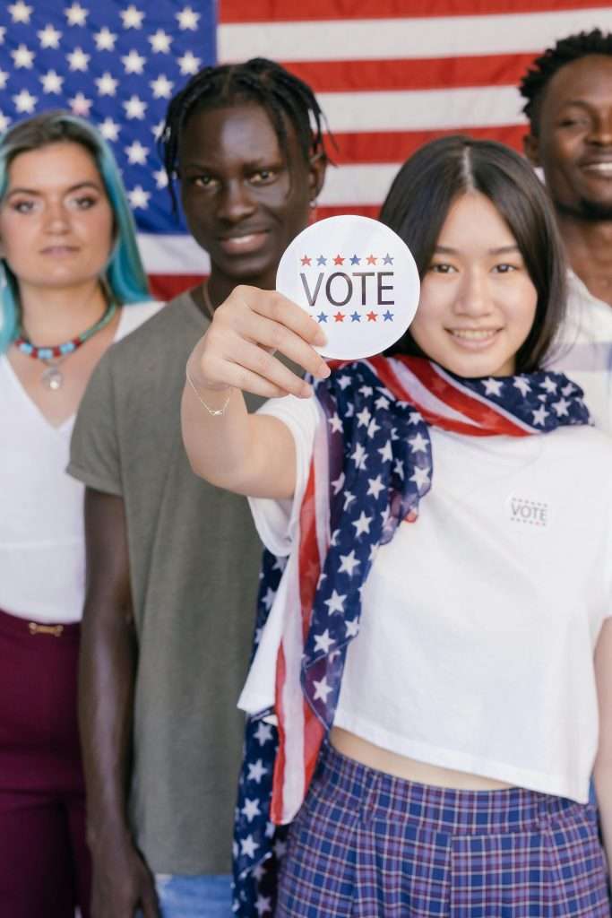Supporter Holding a Vote Badge